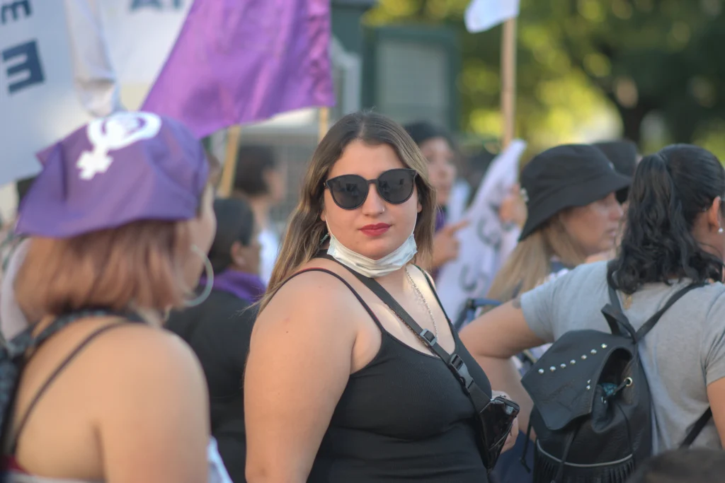 A portrait image of a femme-presenting person and a participant in International Women's Day in Tandil in 2022.
